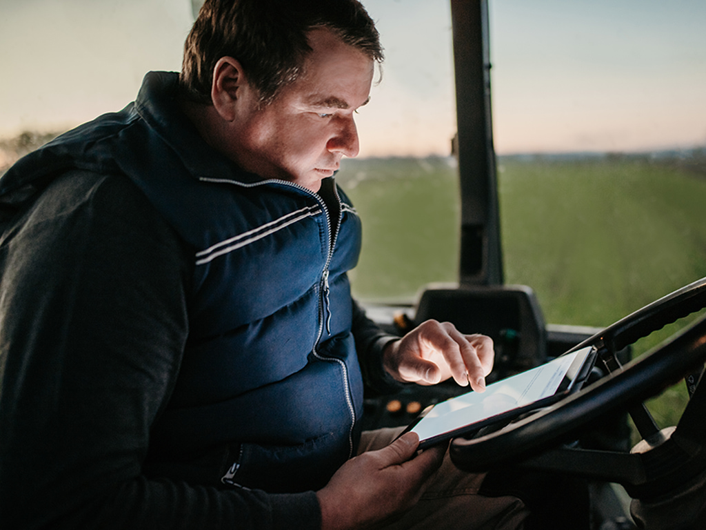 farmer-checking-crops-health-on-tablet