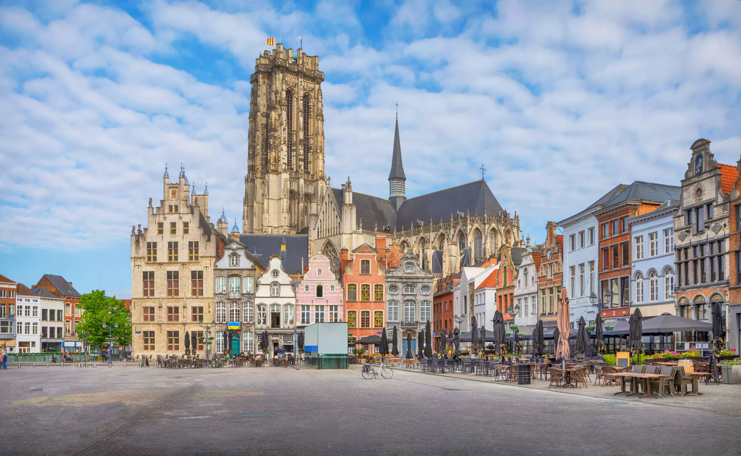 view of Mechelen, Grote Markt Square, tower and colored houses